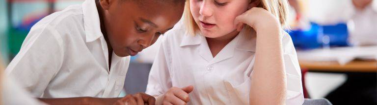 Students working together using iPad