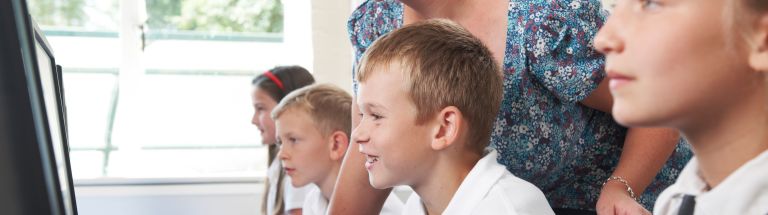 Teacher working with students