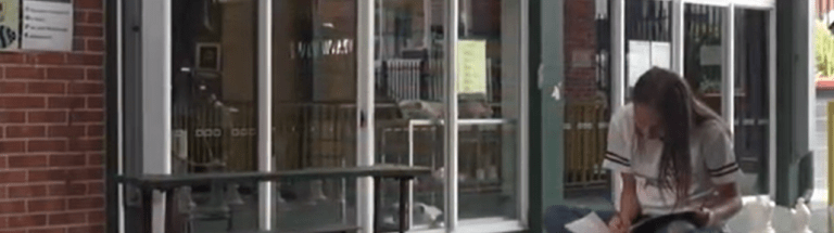 Student studying near bench