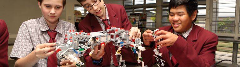 Students assemble a walking LEGO robot