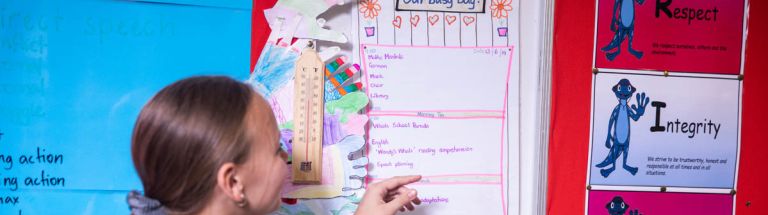 Child reads a visual schedule